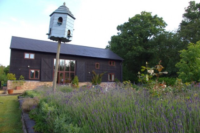 A view of the front and garden of Anstey Grove Barn, high quality bed and breakfast and self-catering accommodation in the Hertfordshire countryside