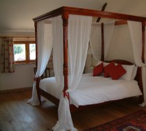 The four-poster bed in the master room at Anstey Grove Barn bed and breakfast and self-catering accommodation The four-poster bed in the master room at Anstey Grove Barn bed and breakfast and self-catering accommodation